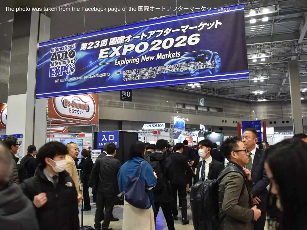 Auto Aftermarket Expo  2027 stand in Tokyo with repair parts display and meeting area