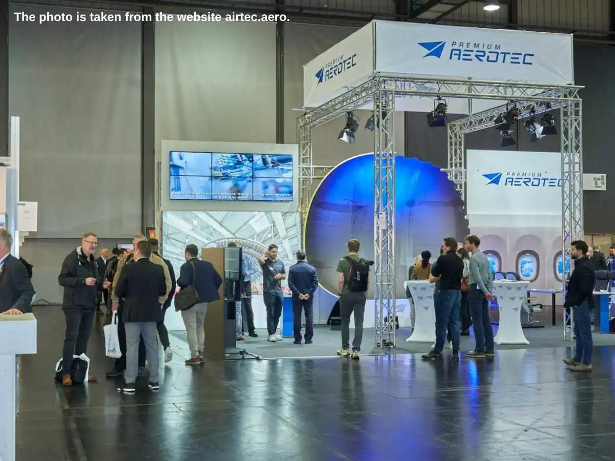 AIRTEC  2026 exhibition stand in Augsburg at Messe Augsburg with meeting area and aerospace demo space
