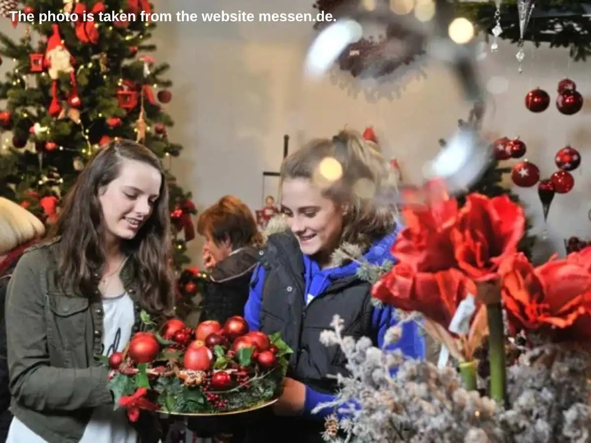 Christmas  2026 exhibition stand in Hanover with candle arches, LED lights, and meeting space at Hannover Messe