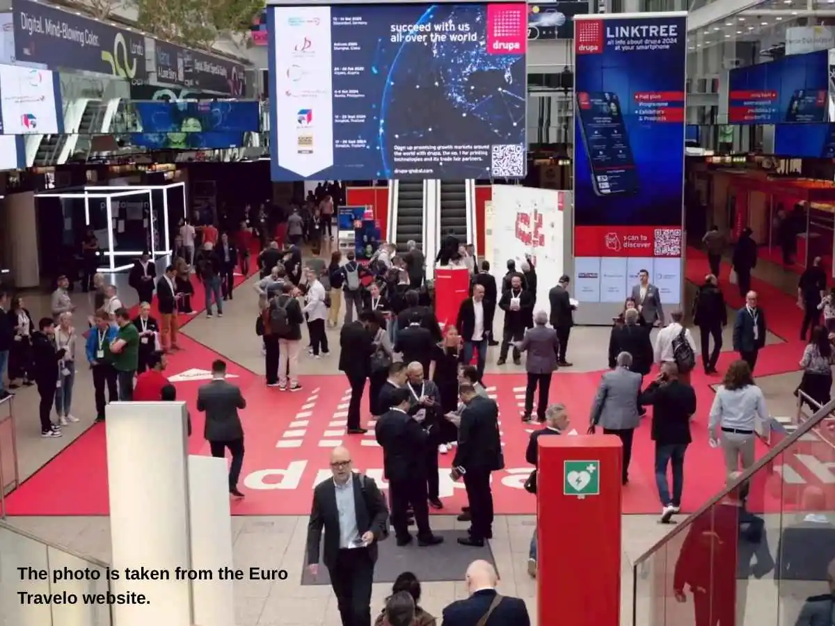 Drupa  2028 stand in Dusseldorf with sample display wall and meeting area at Messe Düsseldorf