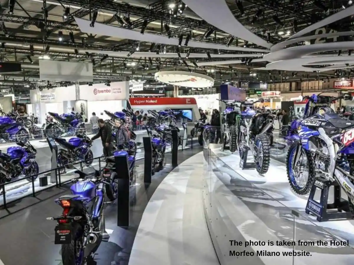 EICMA  2026 stand in Milan with MotoLive-style demo space and meeting zone