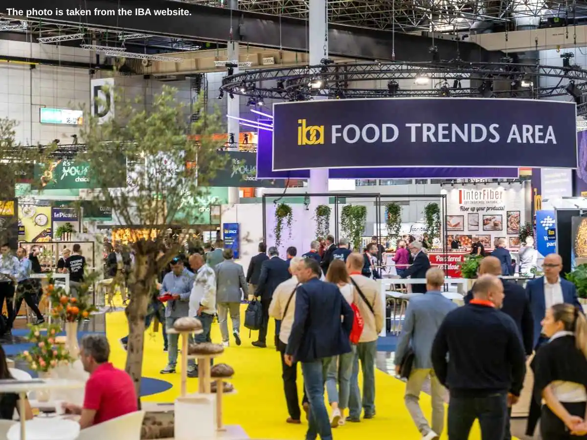 IBA  2027 stand in Dusseldorf with bread bar, meeting area, and Messe Düsseldorf setting