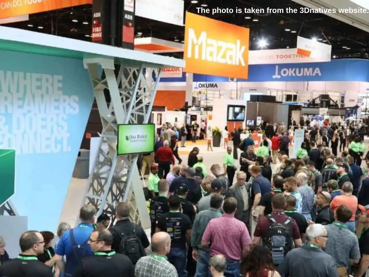 IMTS  2026 stand in Chicago at McCormick Place with machinery display and meeting area