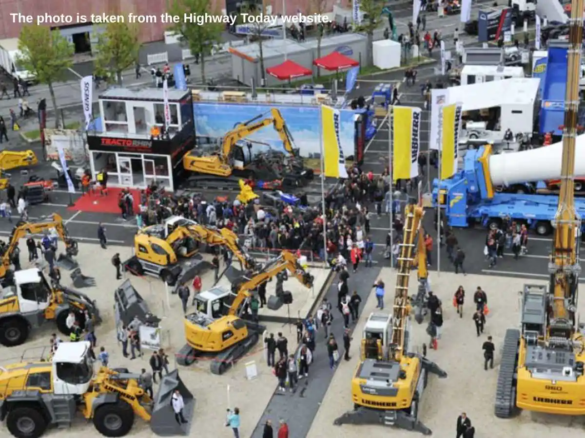 INTERMAT  2027 stand in Paris with heavy machinery demo zone and meeting area at Paris Nord Villepinte