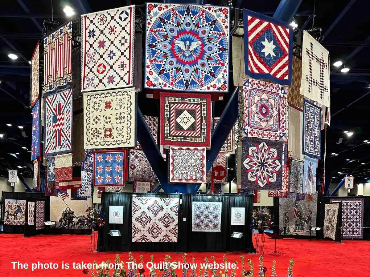 International Quilt Festival  2026 Houston booth at George R. Brown Convention Center with quilting machine demo area