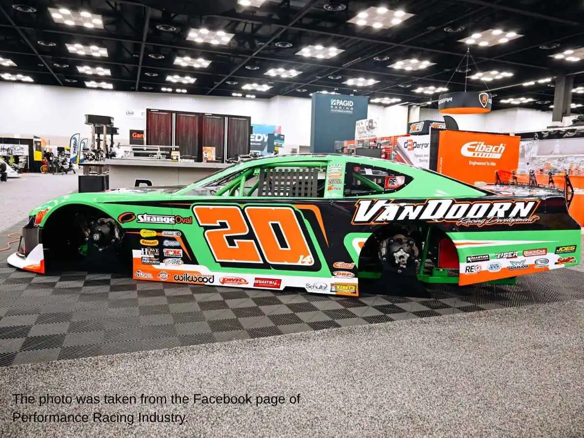 Performance Racing Industry  2026 stand in Indianapolis with vehicle display and meeting area at Indiana Convention Center