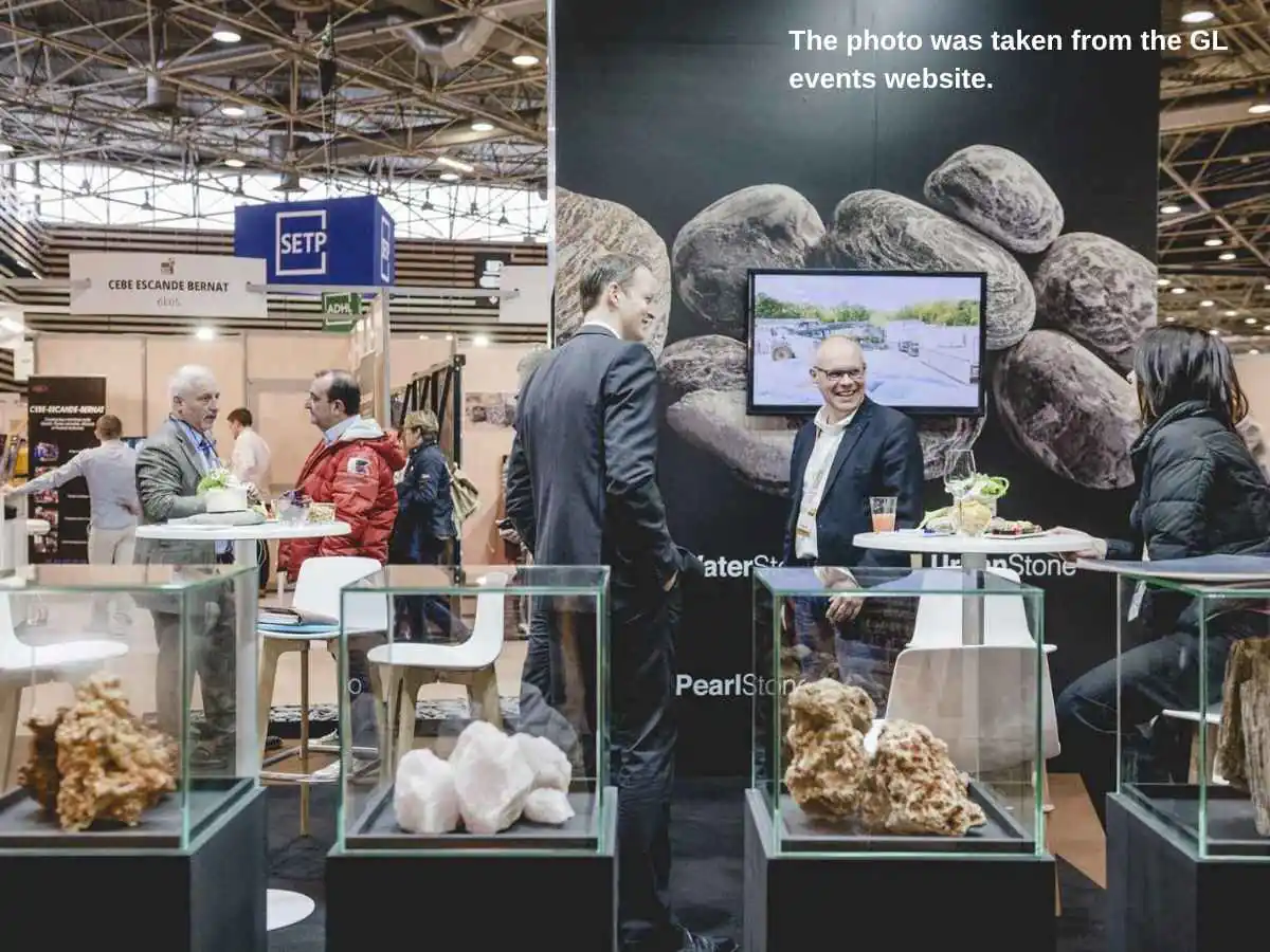 Rocalia  2027 exhibition stand in Lyon with stone sample wall and meeting area
