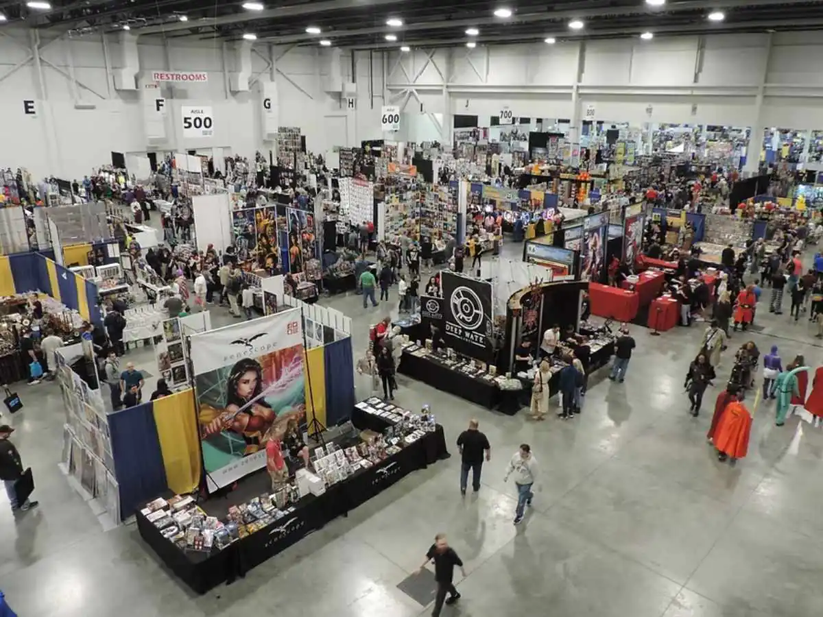 Motor City Comic Con  2026 stand in Novi at Suburban Collection Showplace with screen wall and fan engagement zone
