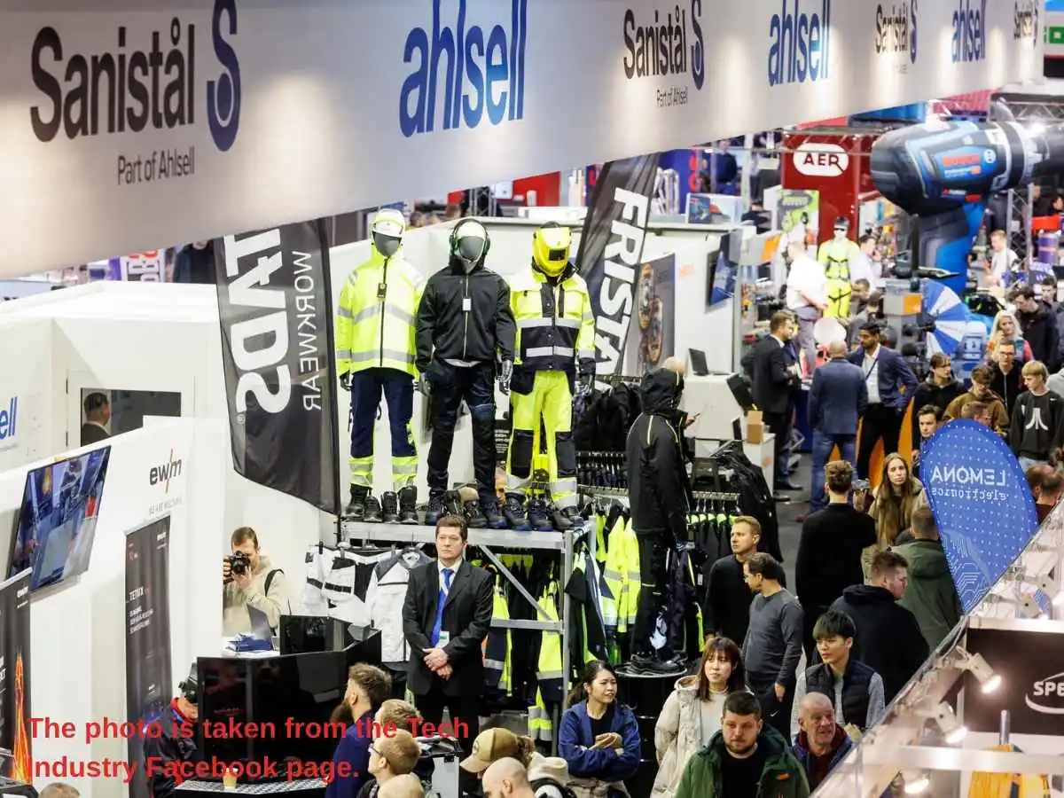 Tech Industry  2026 stand in Riga with industrial engineering demo area and meeting zone
