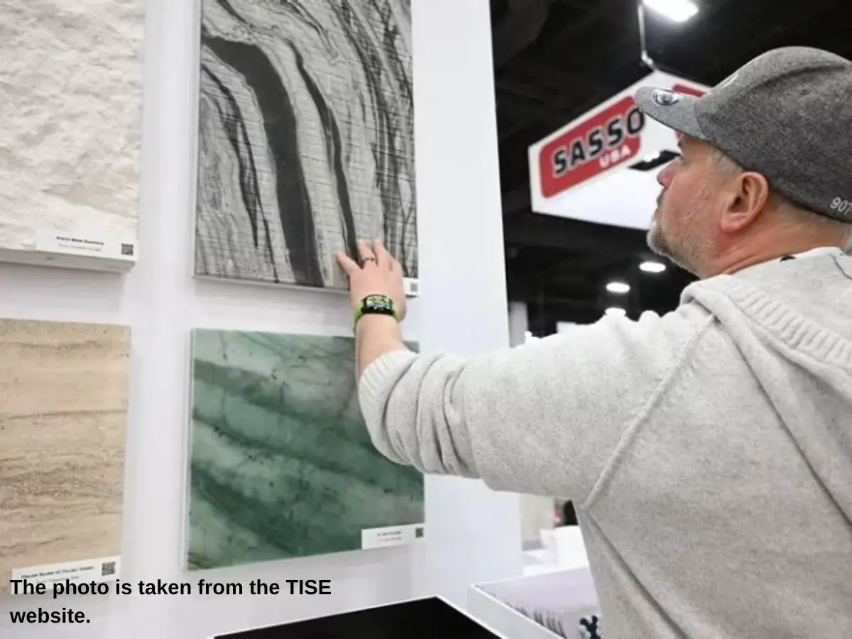 Exhibition stand at TISE Surfaces  2027 in Las Vegas with carpet sample wall and meeting zone