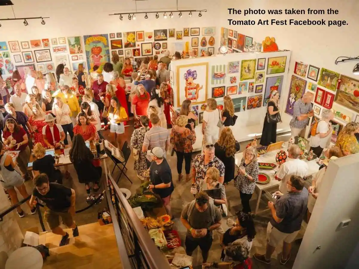 Tomato Art Fest  2026 stand in Nashville with gallery-style display and meeting corner